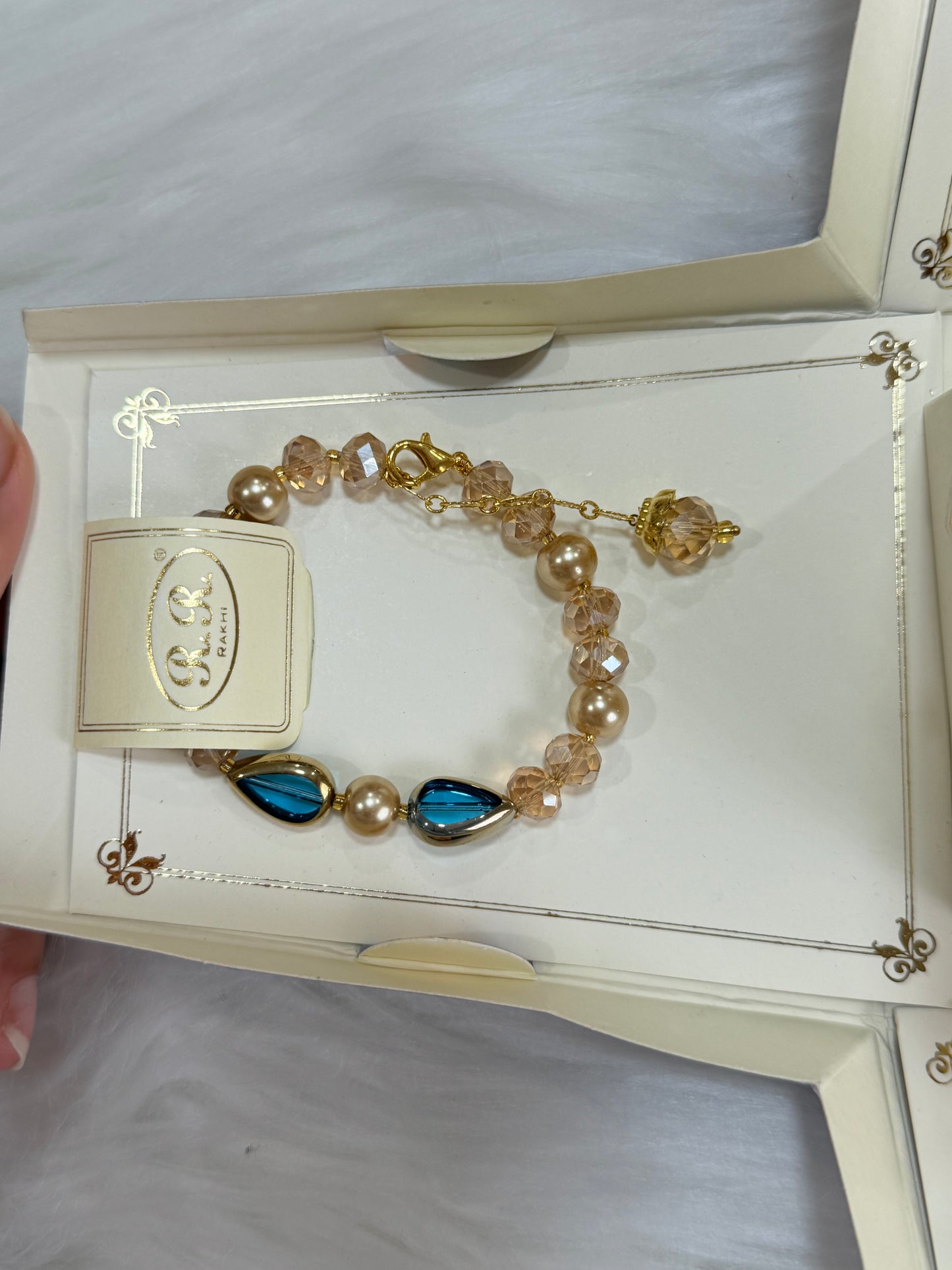Rakhi combo(Bracelet colour may vary and is available in Red or Maroon)