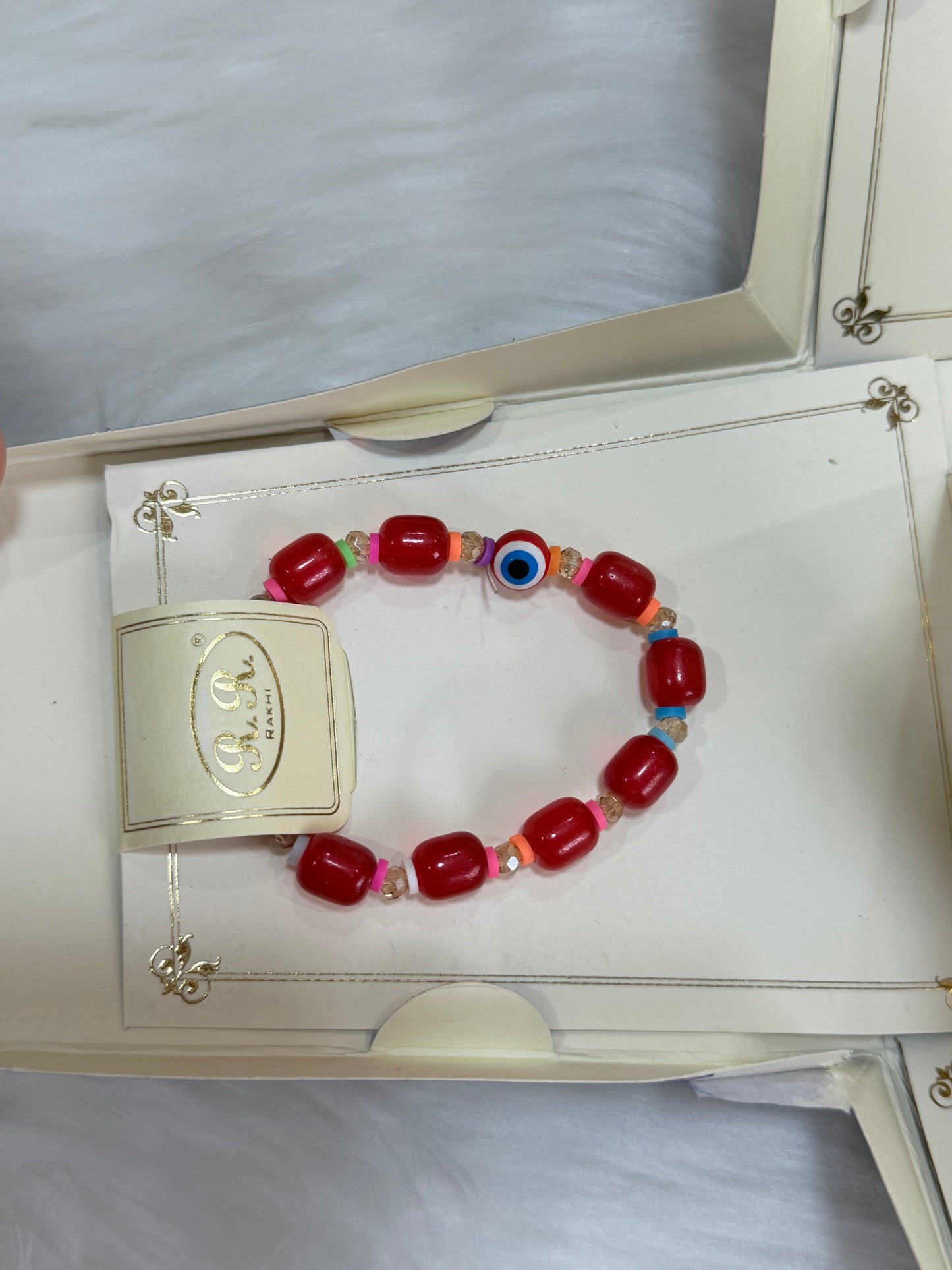 Rakhi combo(Bracelet colour may vary and is available in Red or Maroon)