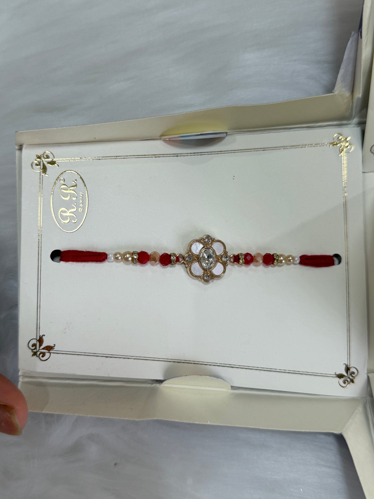Rakhi combo(Bracelet colour may vary and is available in Red or Maroon)